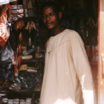 man in white clothes in market